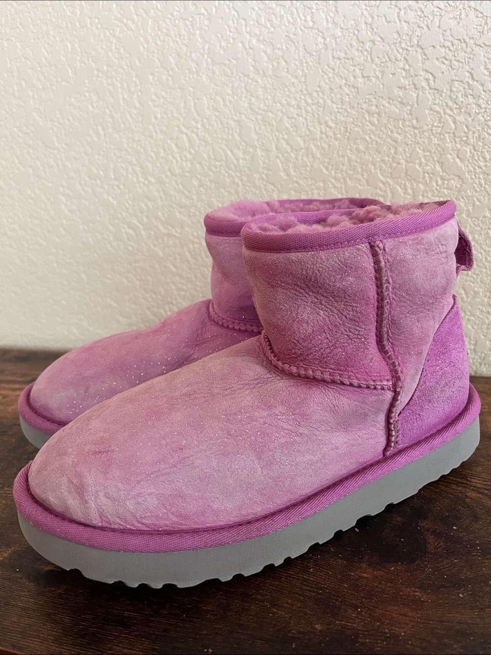 UGG Classic Mini boots in a pink-lilac shade featuring a subtle glitter finish